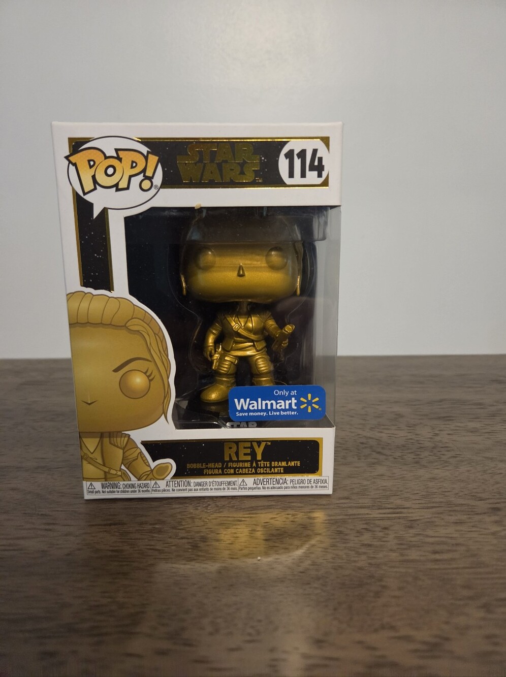 Bobble-Head Funko Pop - Star Wars #114 Rey in Gold vinyl.